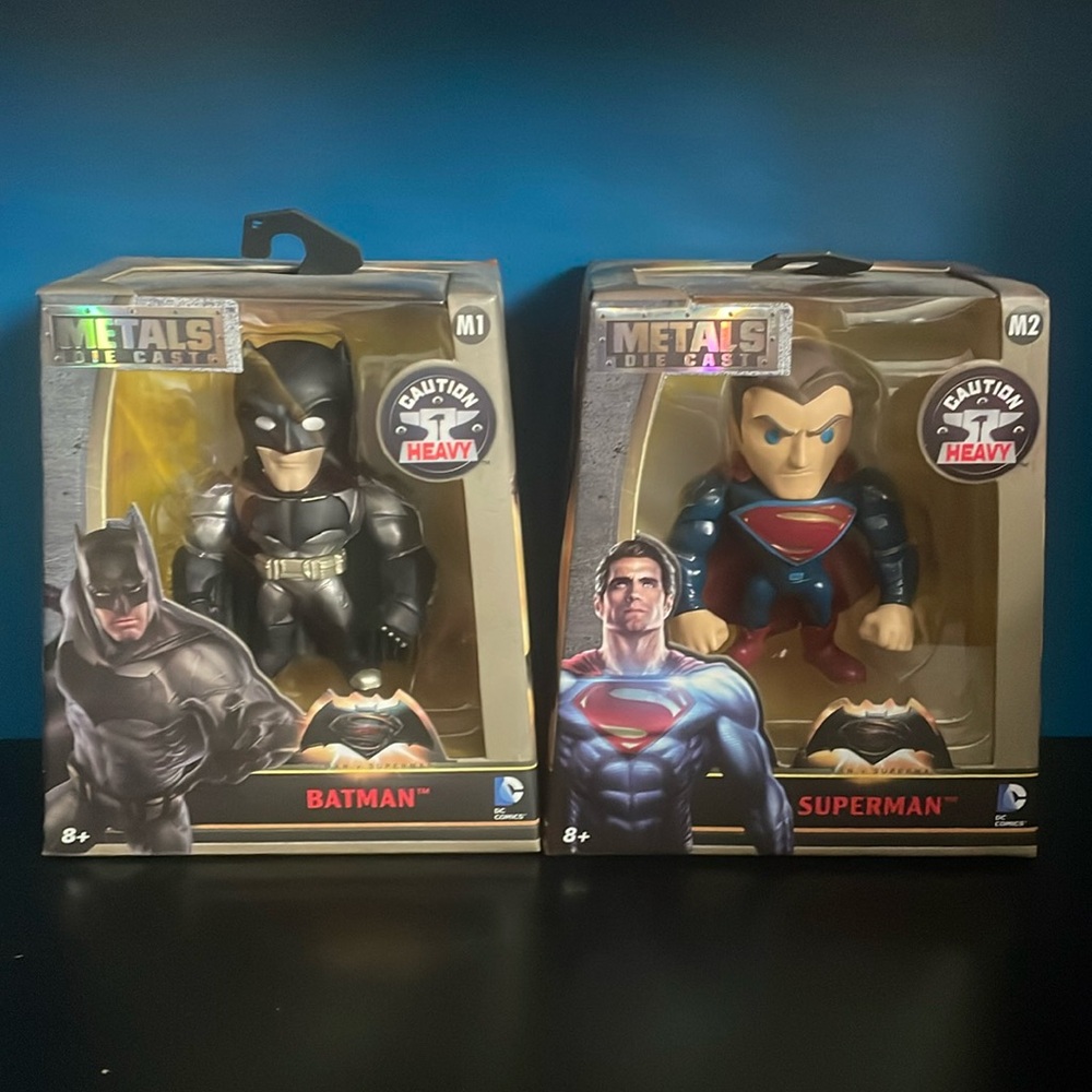 Metals Die Cast DC Superman and Batman figurines (selling as a set).